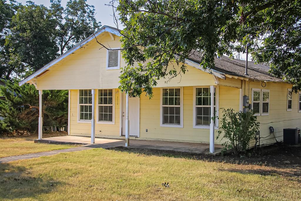 311 Spann Street Bangs, TX 76823 - Photo 1 of 17 front view of a house with a yard