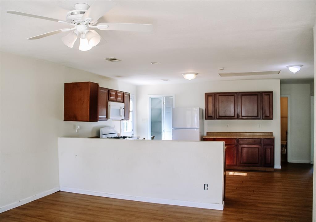 311 Spann Street Bangs, TX 76823 - Photo 5 of 17 a living room with stainless steel appliances kitchen island a furniture and a kitchen view