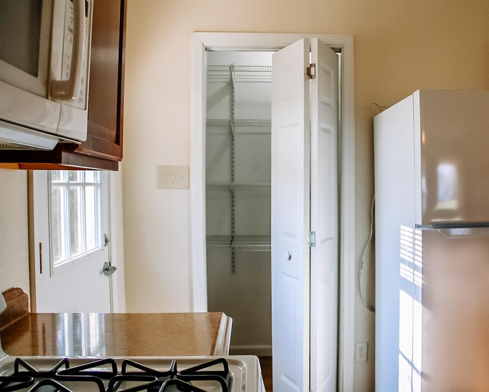 311 Spann Street Bangs, TX 76823 - Photo 8 of 17 a view of a workspace with furniture and a window