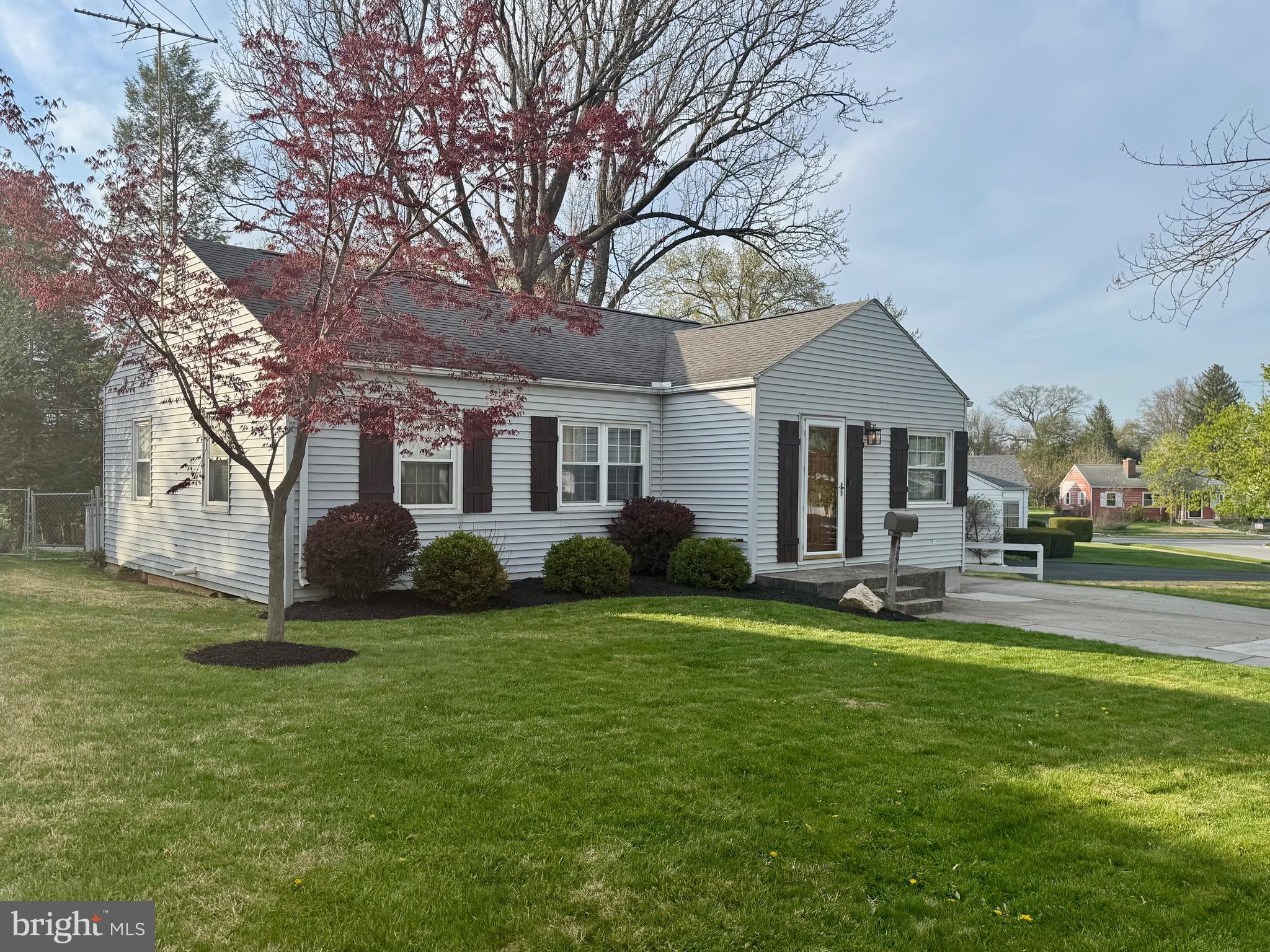1294 Warwick Road Camp Hill, PA 17011 - Photo 1 of 27 a view of a house with a big yard and large trees