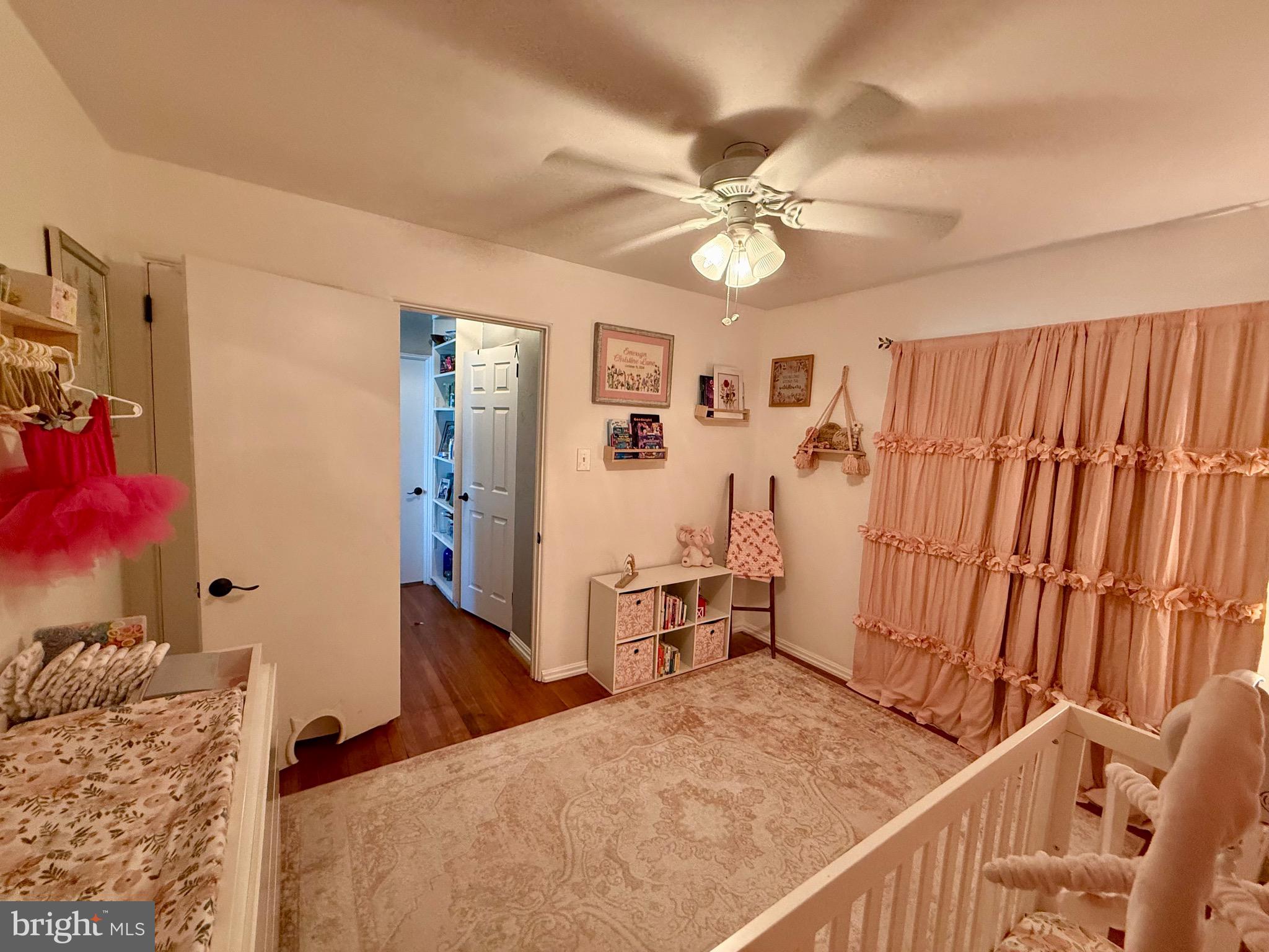 1294 Warwick Road Camp Hill, PA 17011 - Photo 12 of 27 a bedroom with a bed and a chandelier