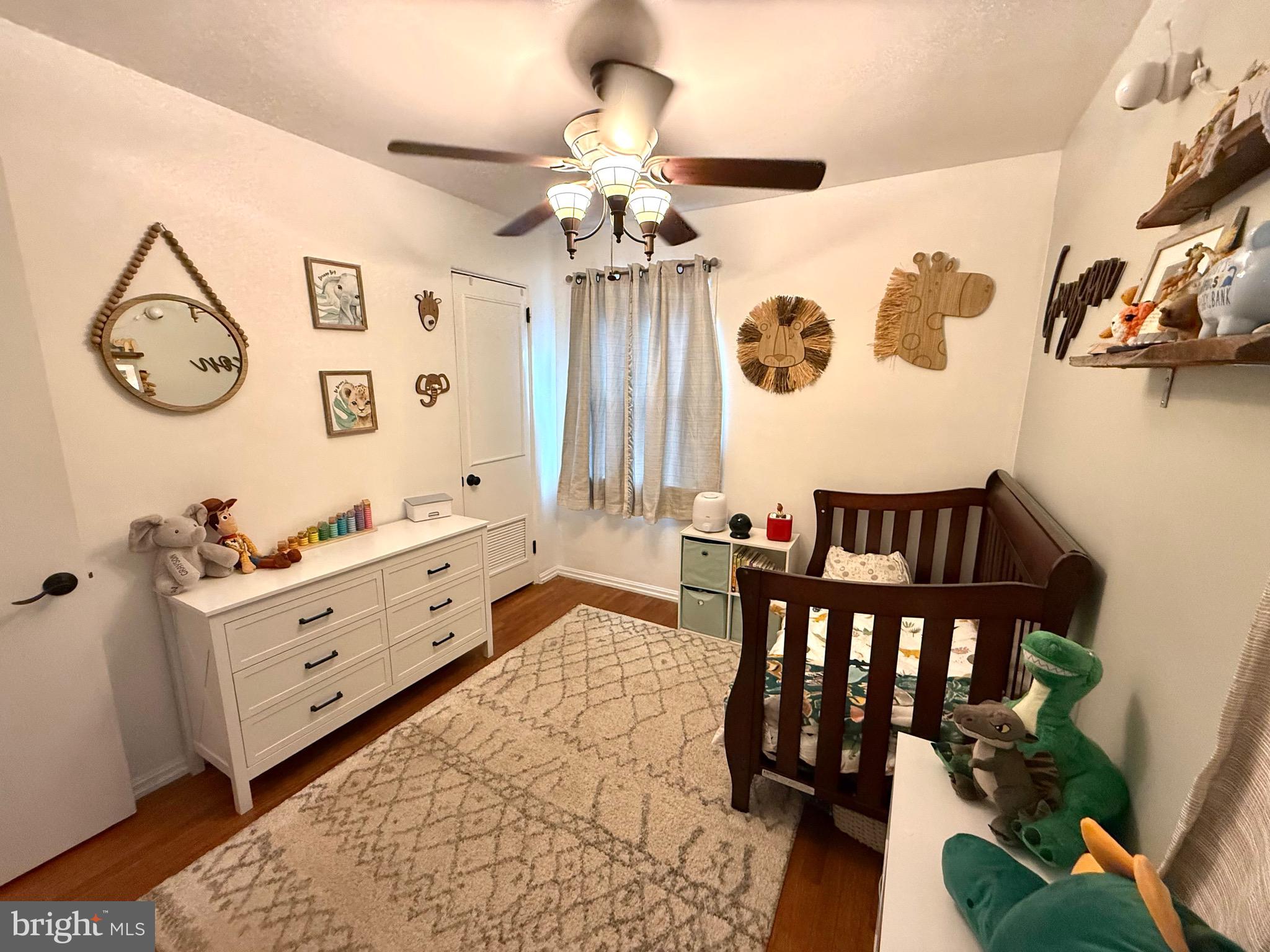 1294 Warwick Road Camp Hill, PA 17011 - Photo 16 of 27 a spacious bedroom with a bed and a chandelier
