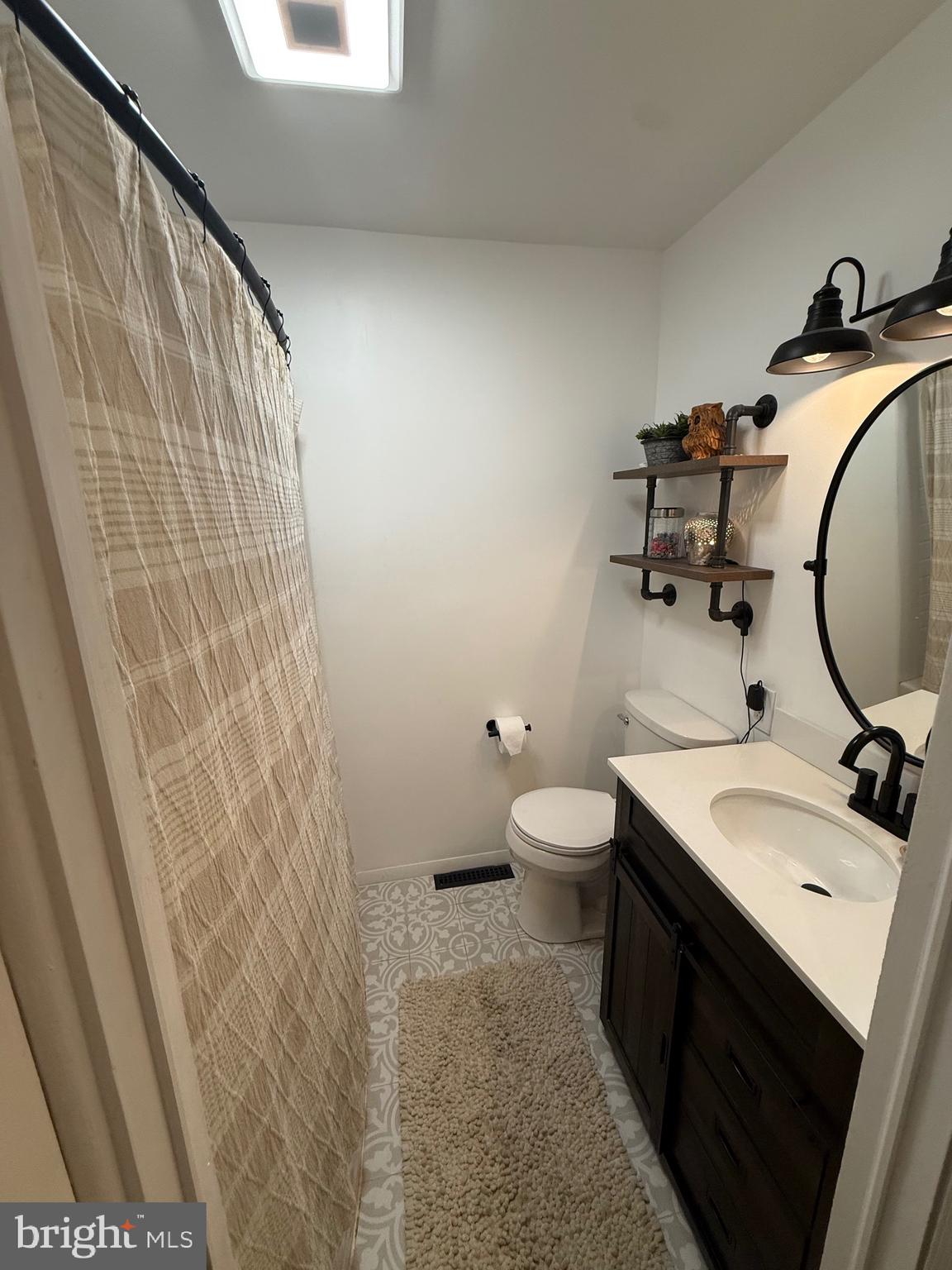 1294 Warwick Road Camp Hill, PA 17011 - Photo 21 of 27 a bathroom with a sink and a mirror