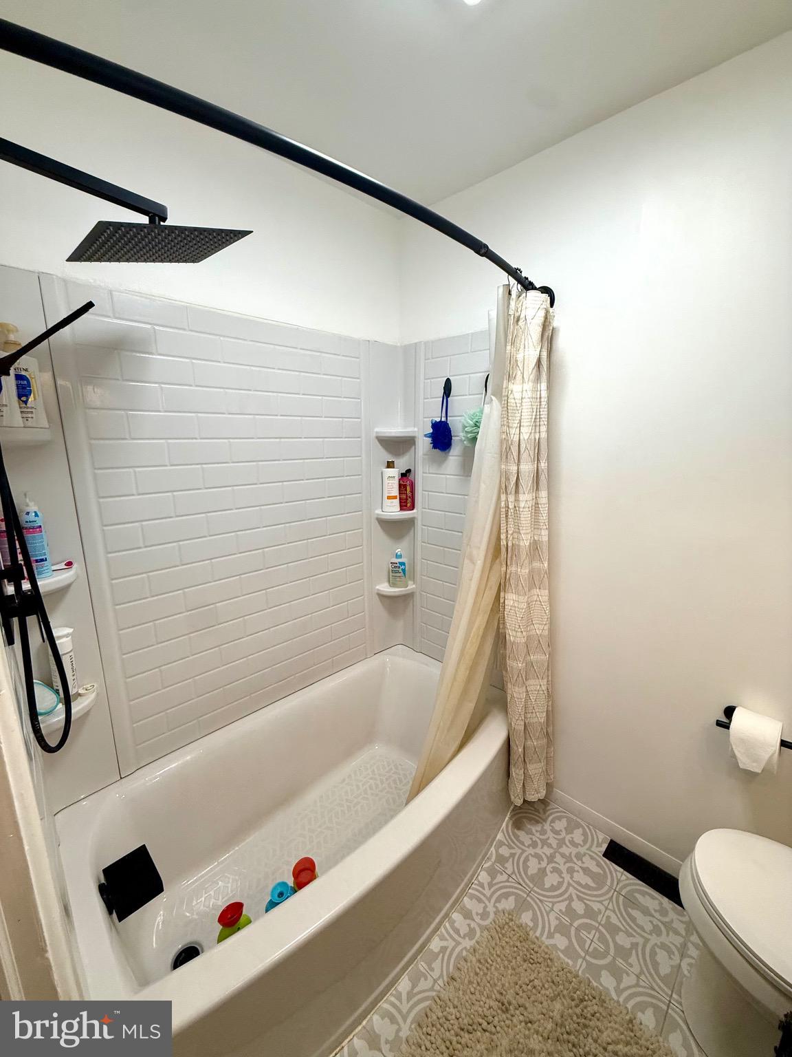 1294 Warwick Road Camp Hill, PA 17011 - Photo 22 of 27 a bathroom with a bathtub and a shower
