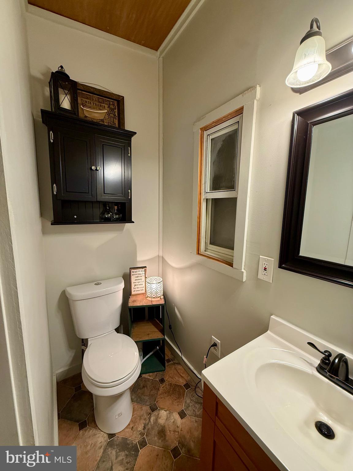 1294 Warwick Road Camp Hill, PA 17011 - Photo 23 of 27 a bathroom with a toilet sink and mirror