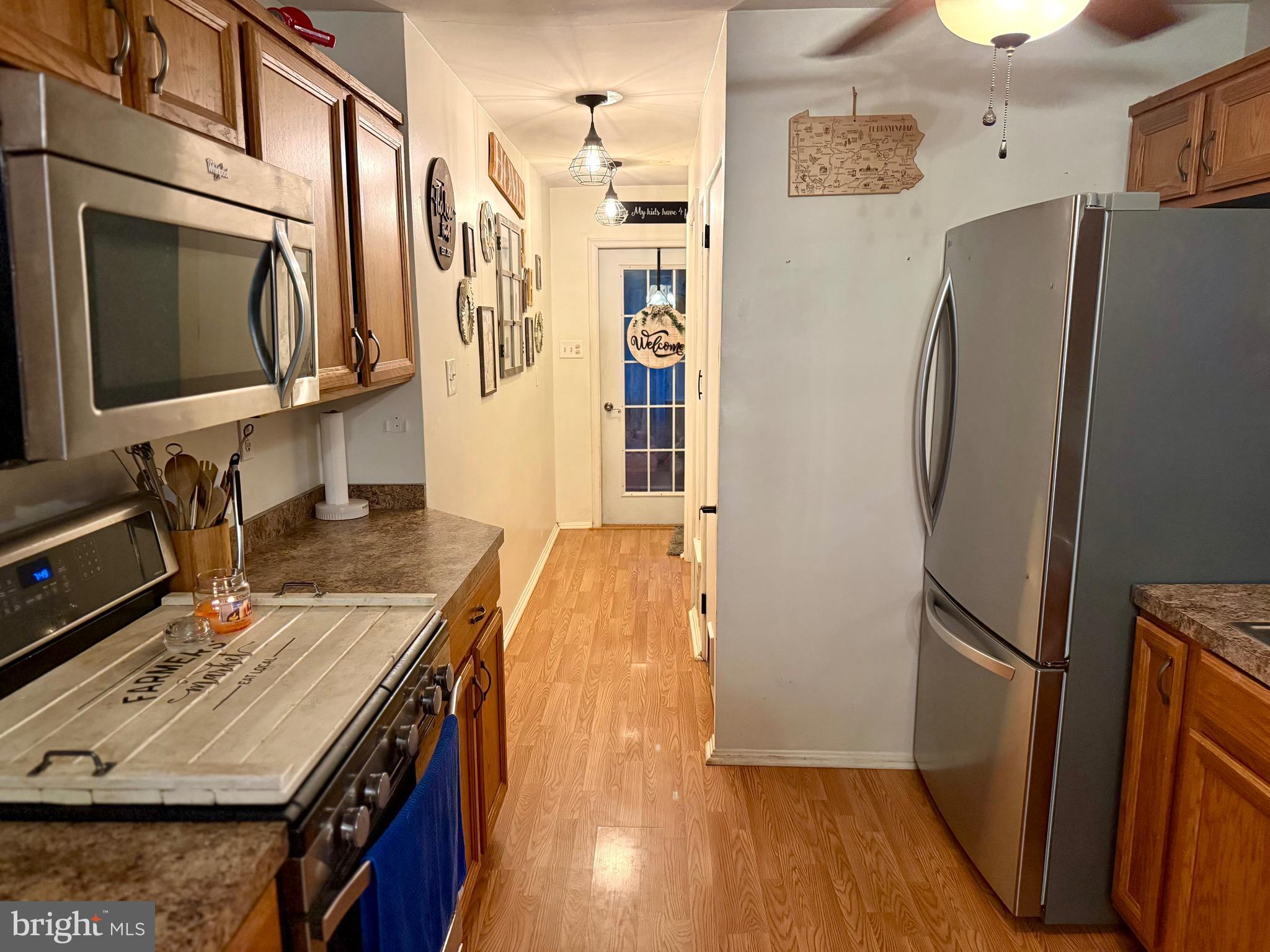 1294 Warwick Road Camp Hill, PA 17011 - Photo 4 of 27 a kitchen with stainless steel appliances granite countertop a refrigerator and a stove