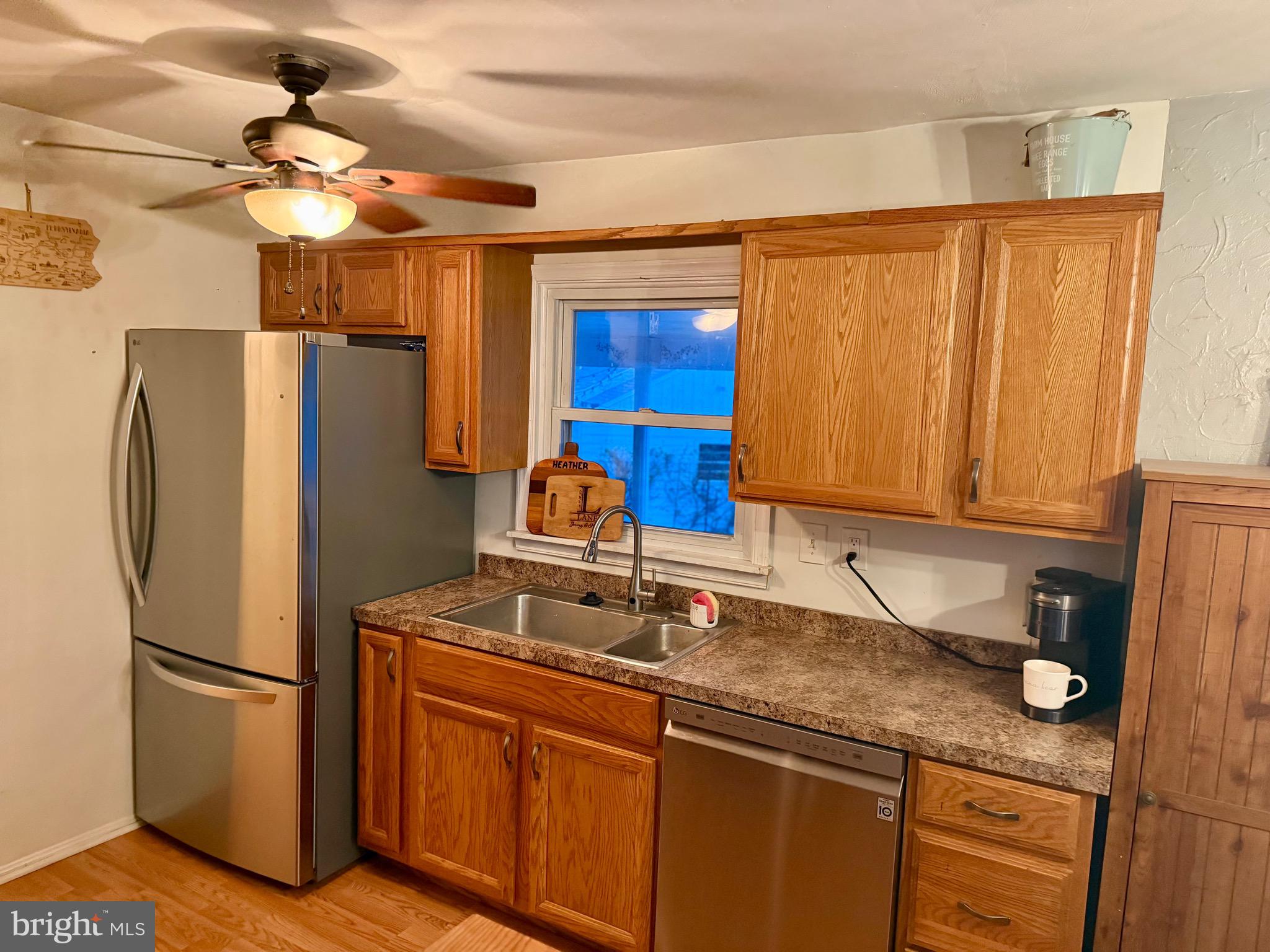 1294 Warwick Road Camp Hill, PA 17011 - Photo 5 of 27 a kitchen with stainless steel appliances granite countertop a refrigerator and a sink