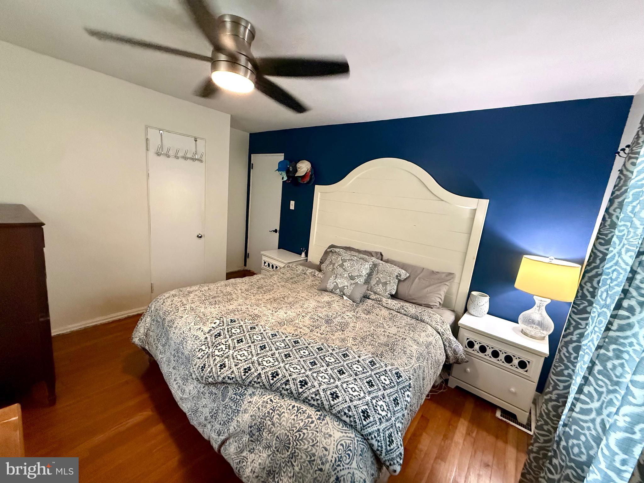 1294 Warwick Road Camp Hill, PA 17011 - Photo 8 of 27 a bedroom with a bed and a flat tv screen