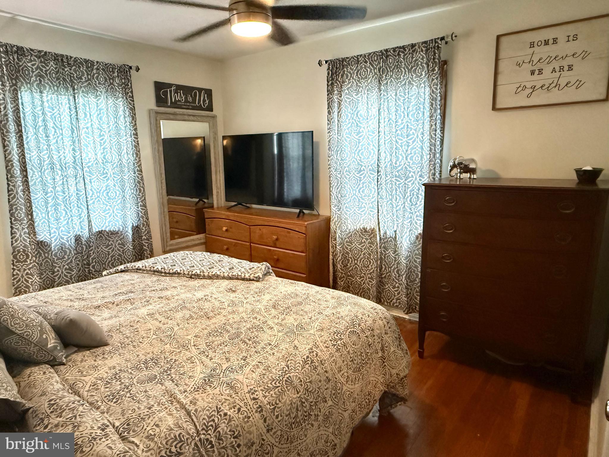 1294 Warwick Road Camp Hill, PA 17011 - Photo 9 of 27 a bedroom with a bed and a flat tv screen on dresser