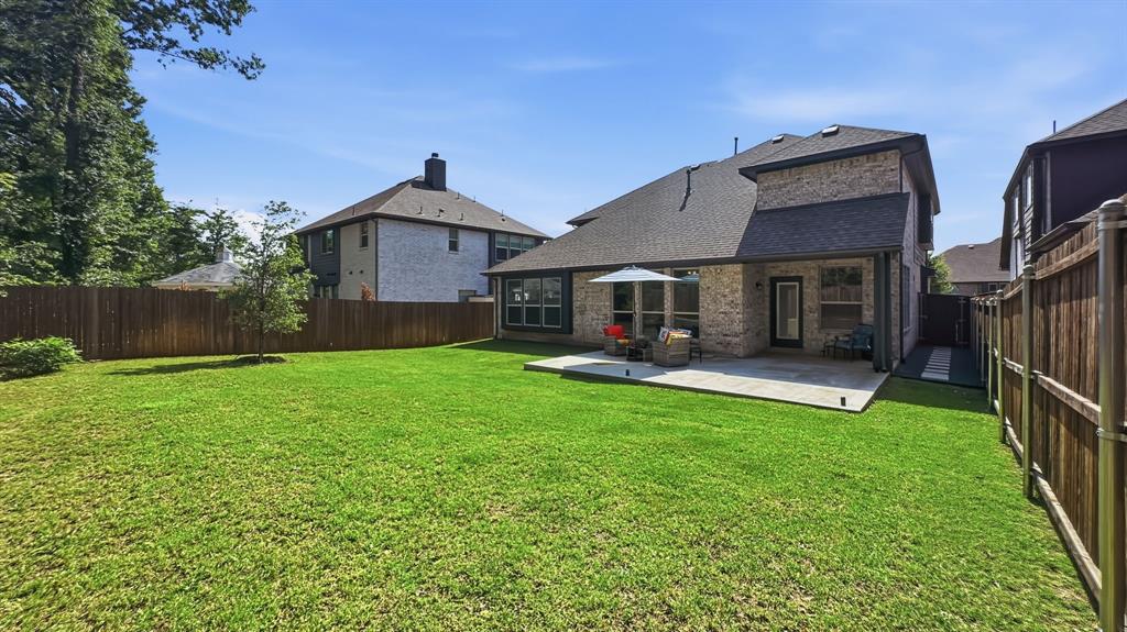 5216 Troupe Road McKinney, TX 75071 - Photo 37 of 40 Expansive green lawn with a privacy fence