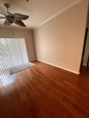 an empty room with wooden floor