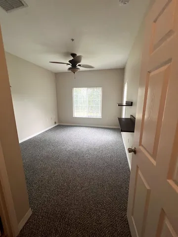 a view of livingroom with window and a fireplace