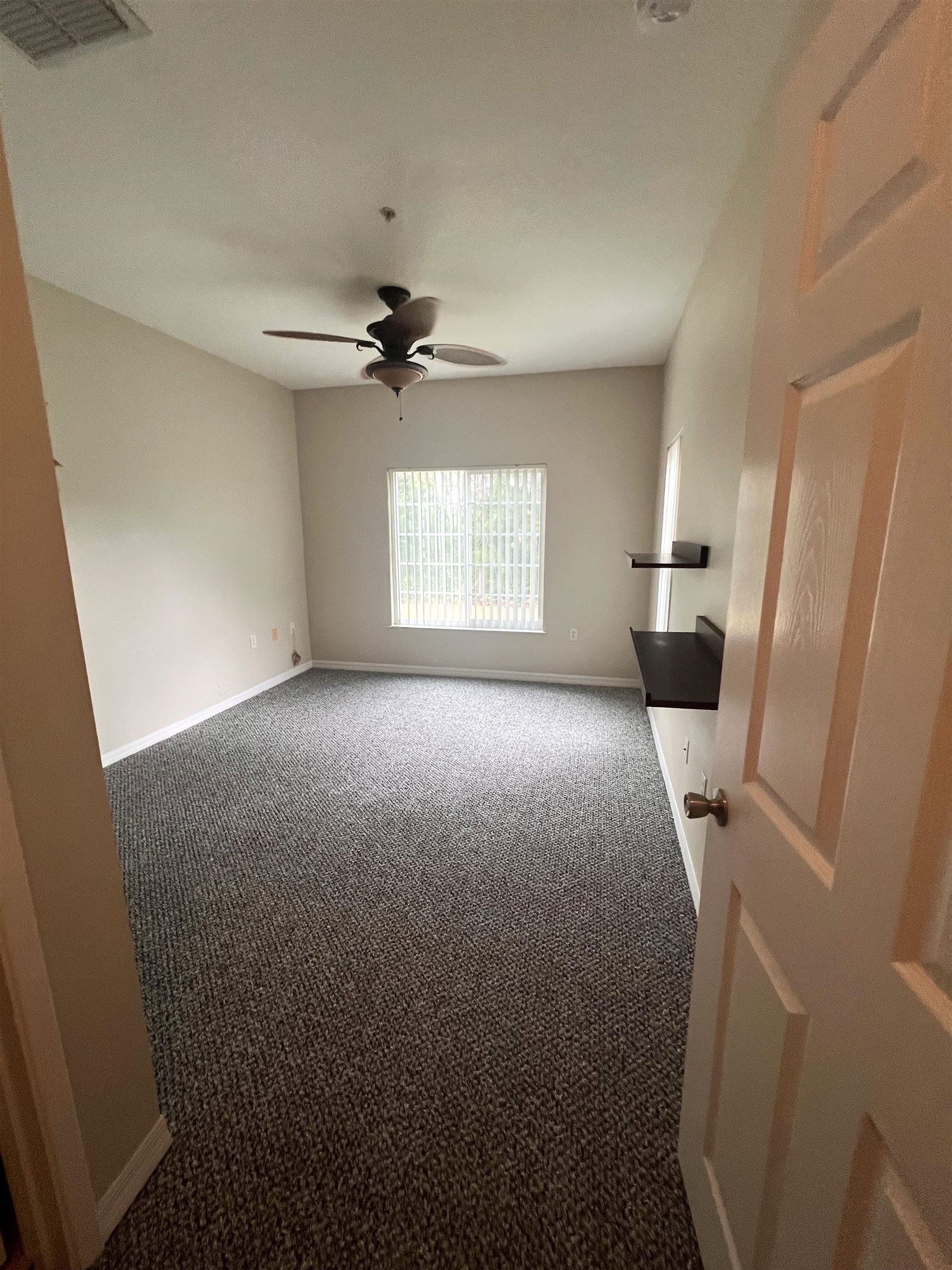 520 Florida Club Boulevard, Unit 212 St. Augustine, FL 32084 - Photo 15 of 28 a view of livingroom with window and a fireplace