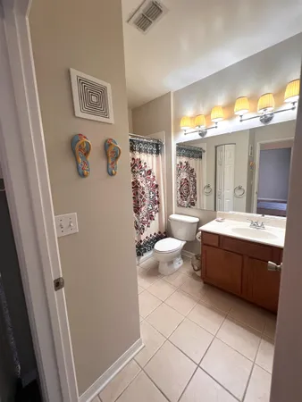 a spacious bathroom with a bathtub sink and toilet