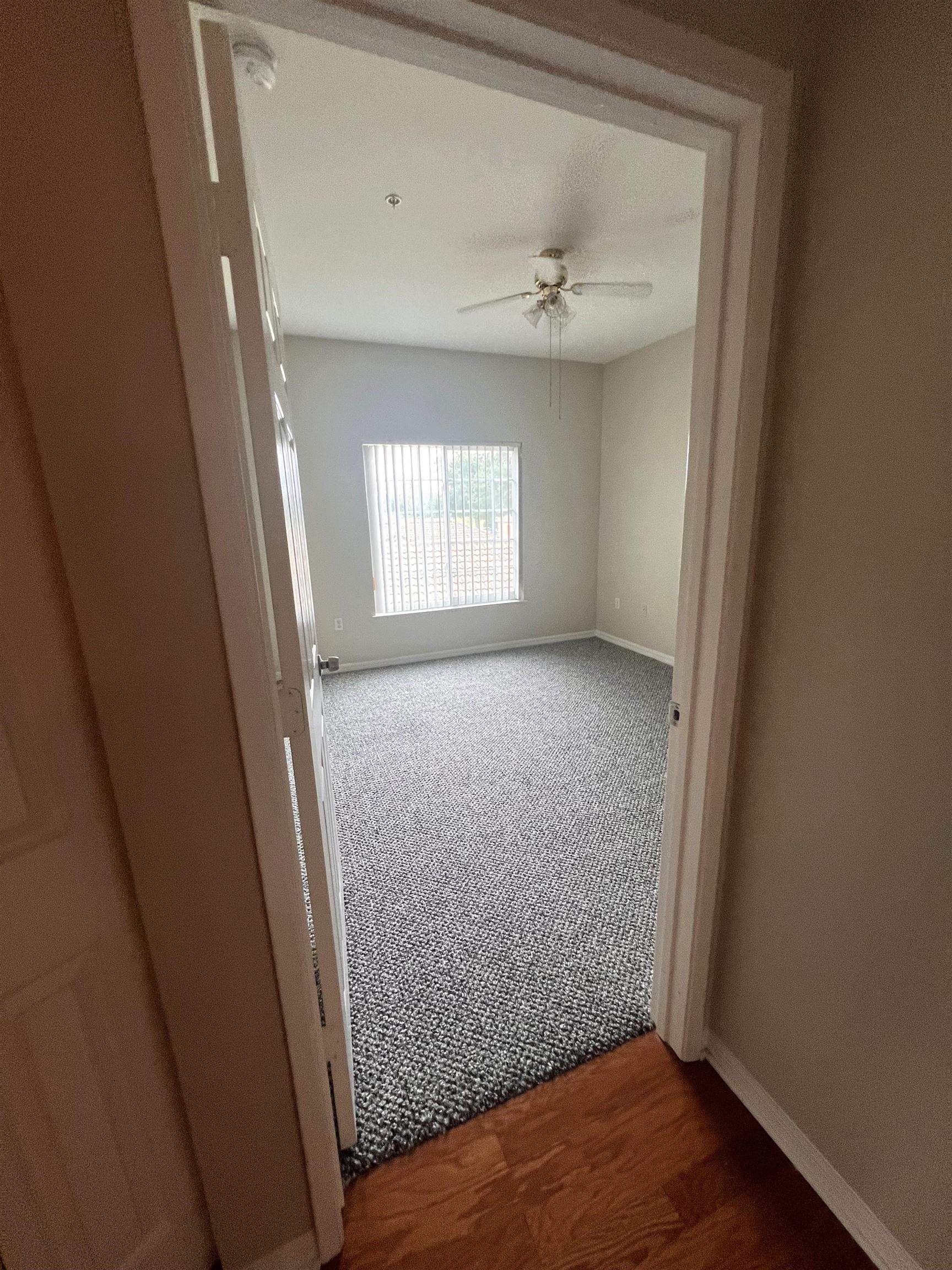 520 Florida Club Boulevard, Unit 212 St. Augustine, FL 32084 - Photo 18 of 28 an empty room with wooden floor and windows