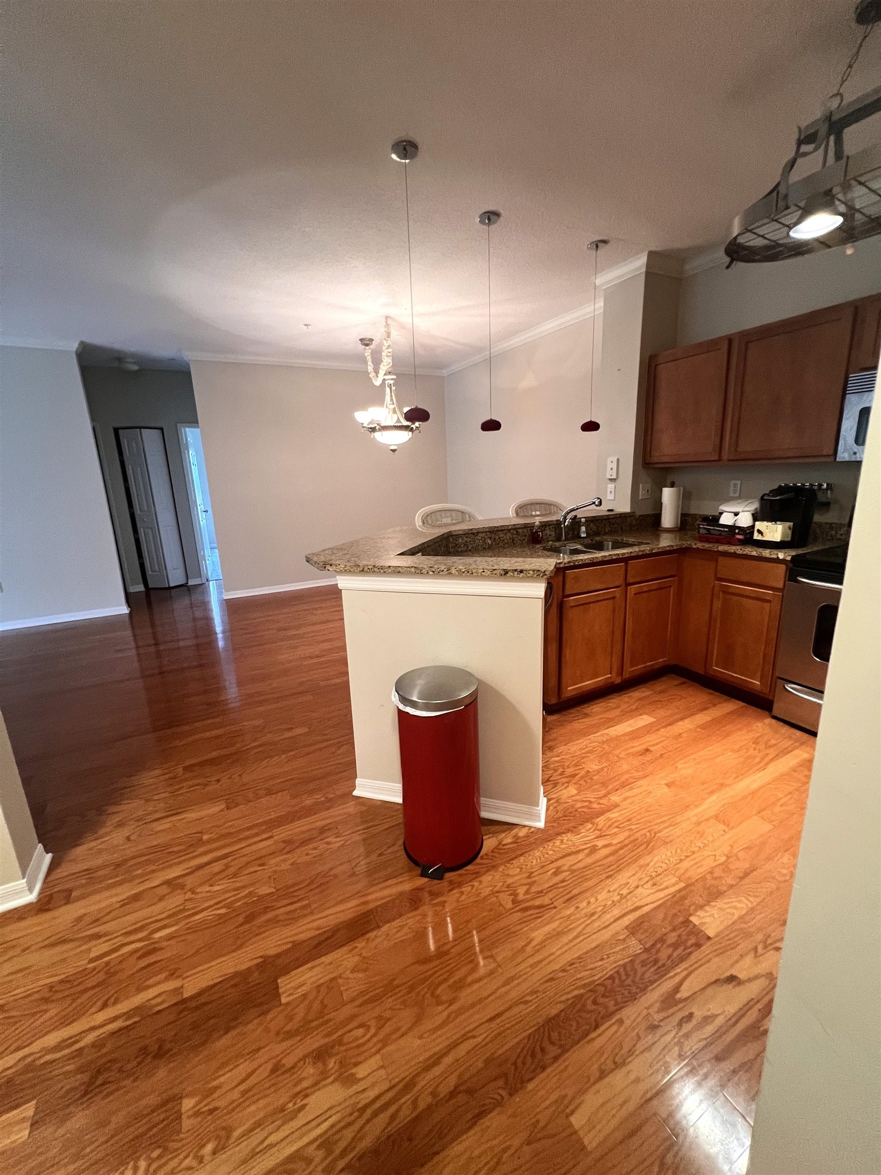 520 Florida Club Boulevard, Unit 212 St. Augustine, FL 32084 - Photo 2 of 28 a kitchen with stainless steel appliances granite countertop a stove and a wooden floors