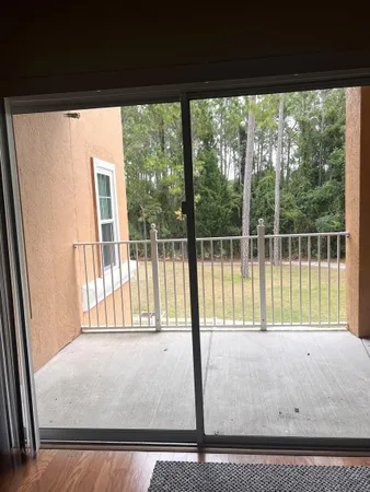 a view of a room that has a bed