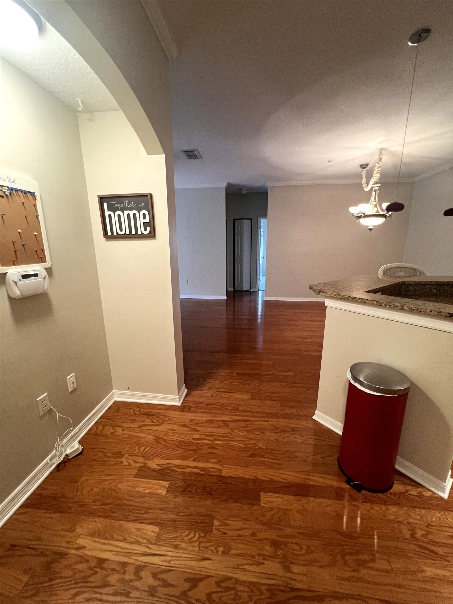 520 Florida Club Boulevard, Unit 212 St. Augustine, FL 32084 - Photo 3 of 28 a view of a kitchen with kitchen island a sink wooden floor and glass door