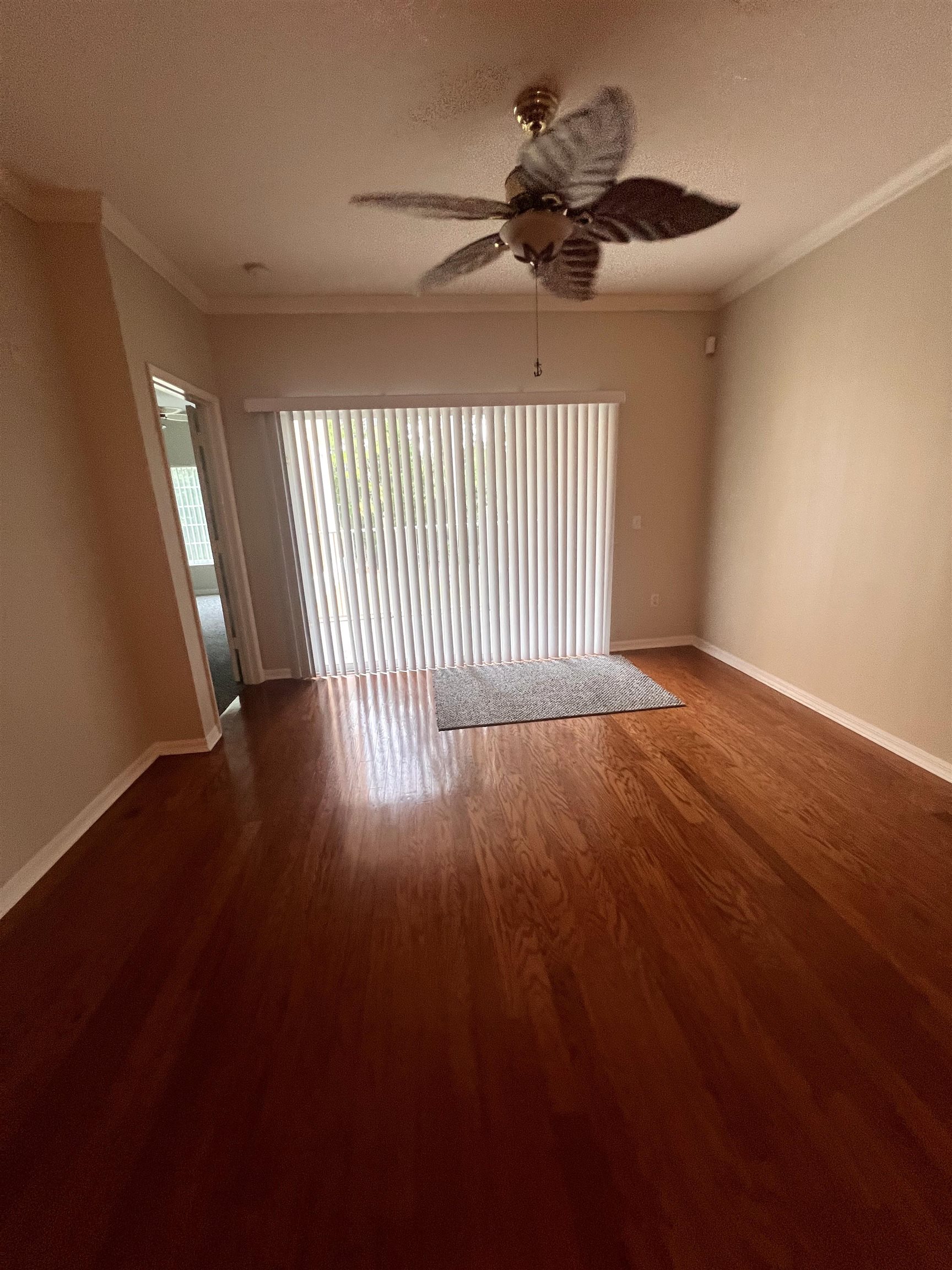 520 Florida Club Boulevard, Unit 212 St. Augustine, FL 32084 - Photo 10 of 28 a view of a livingroom with wooden floor and a ceiling fan