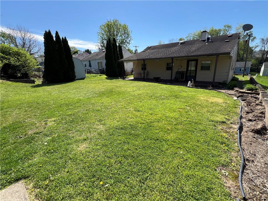 203 Carson Street Springdale, PA 15144 - Photo 27 of 43 a view of a house with backyard and a tree