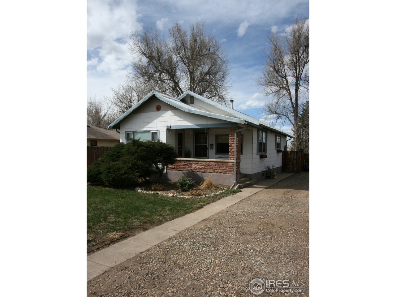 311 West Baseline Road Lafayette, CO 80026 - Photo 16 of 16 a front view of a house with garden