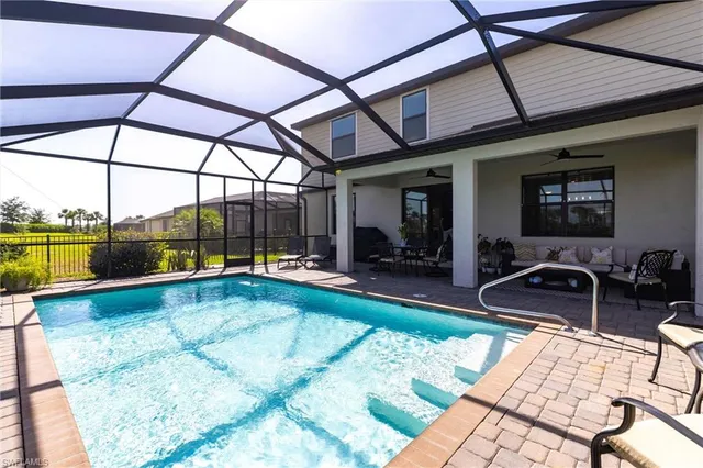 a view of a lake with houses in the back