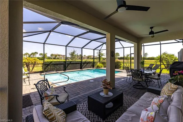 a view of a hallway with white walls and stairs