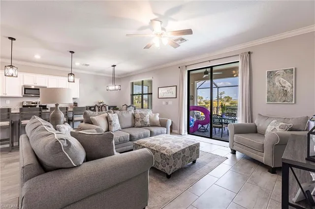 a living room with furniture kitchen view and a table