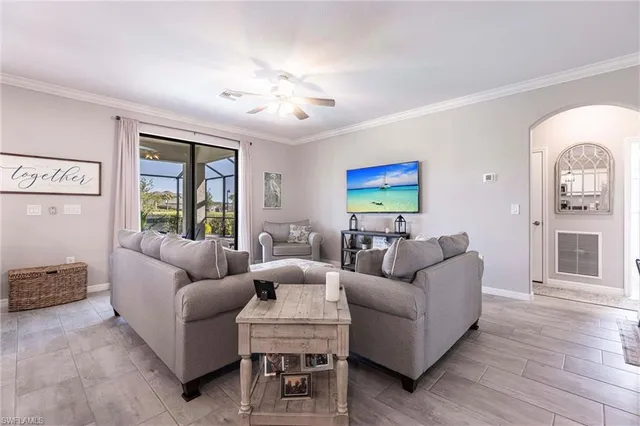 a kitchen with a dining table chairs sink and refrigerator