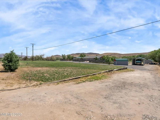a living room with furniture large window and a flat screen tv