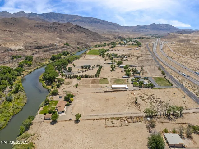 a view of lake with houses in the back