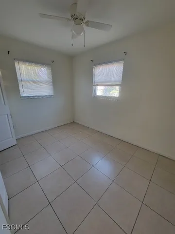 a view of an empty room and a window