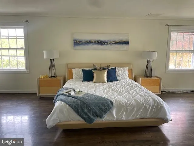 a bathroom with mirror and shower