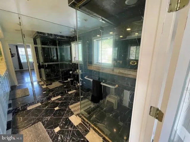 a spacious bedroom with a bed and a window