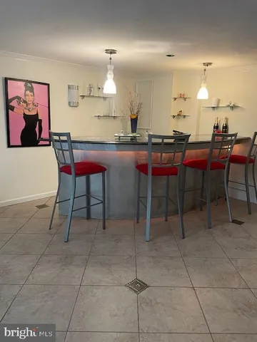 a white house with a yard and garden