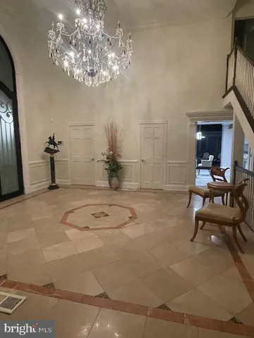a bathroom with a sink mirror and a shower