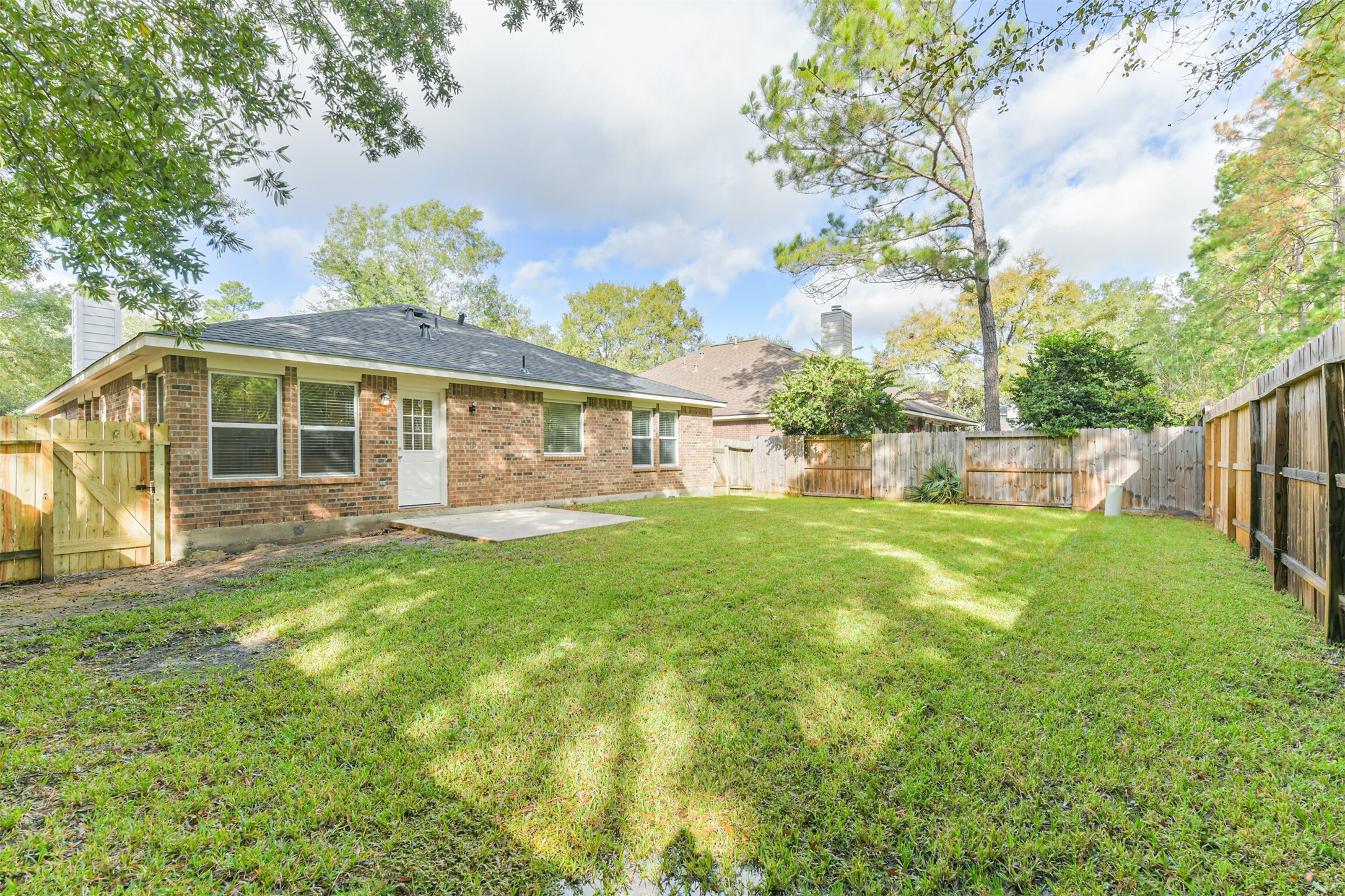 42 Prairie Oak Drive Conroe, TX 77385 - Photo 31 of 33 a view of a house with backyard and a tree