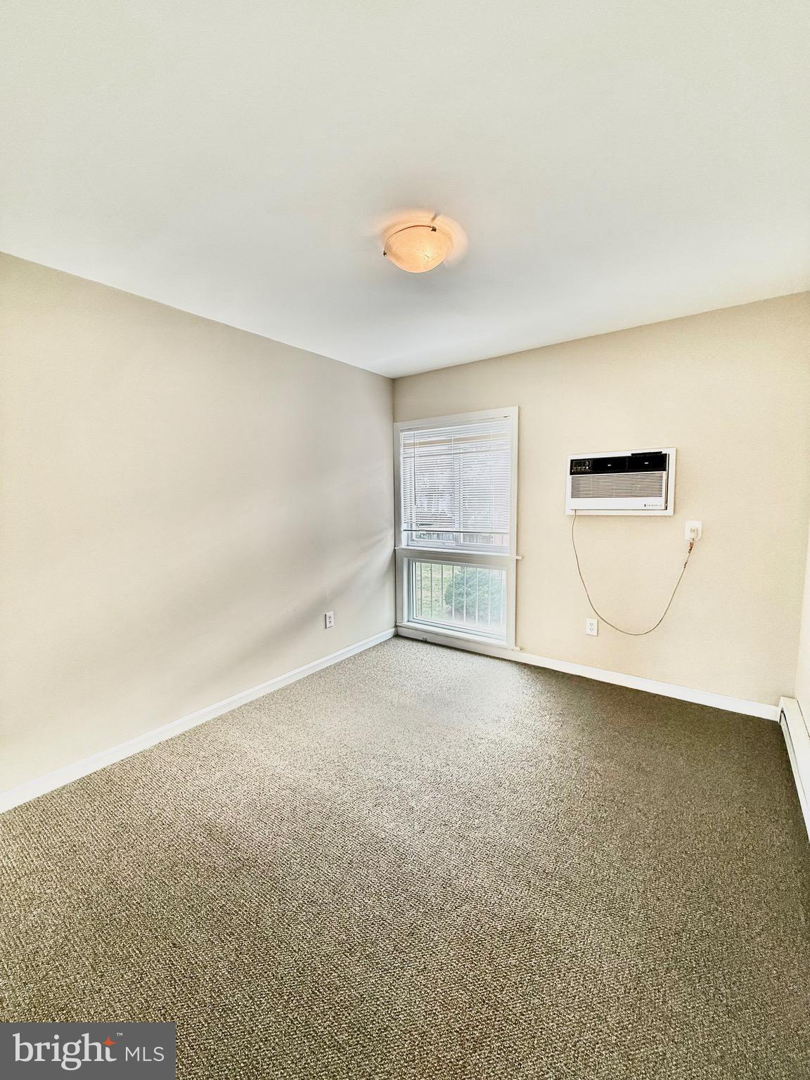 720 West Glebe Road, Unit 2C Alexandria, VA 22305 - Photo 5 of 13 an empty room with a empty space and windows