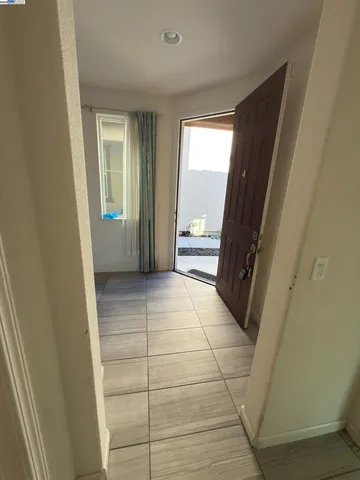 a view of a house with a backyard and a porch