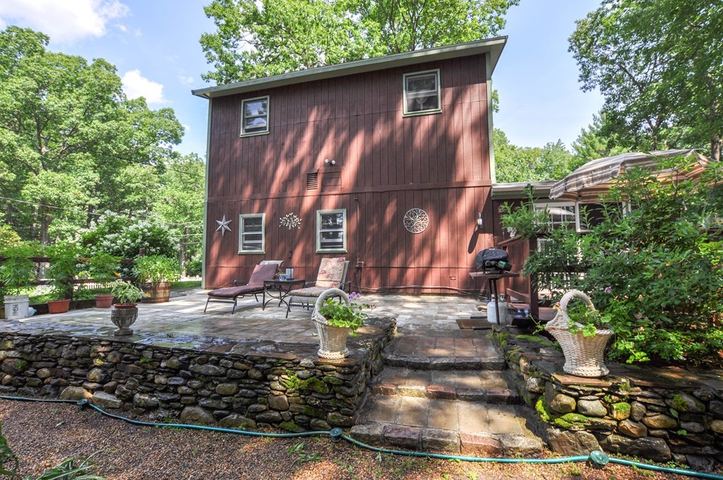 3 South Row Road Lunenburg, MA 01462 - Photo 18 of 29 a backyard of a house with outdoor seating