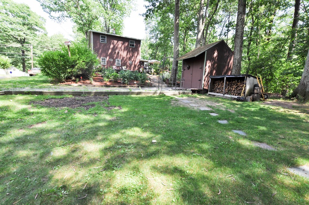 3 South Row Road Lunenburg, MA 01462 - Photo 20 of 29 a view of a wooden house with a yard