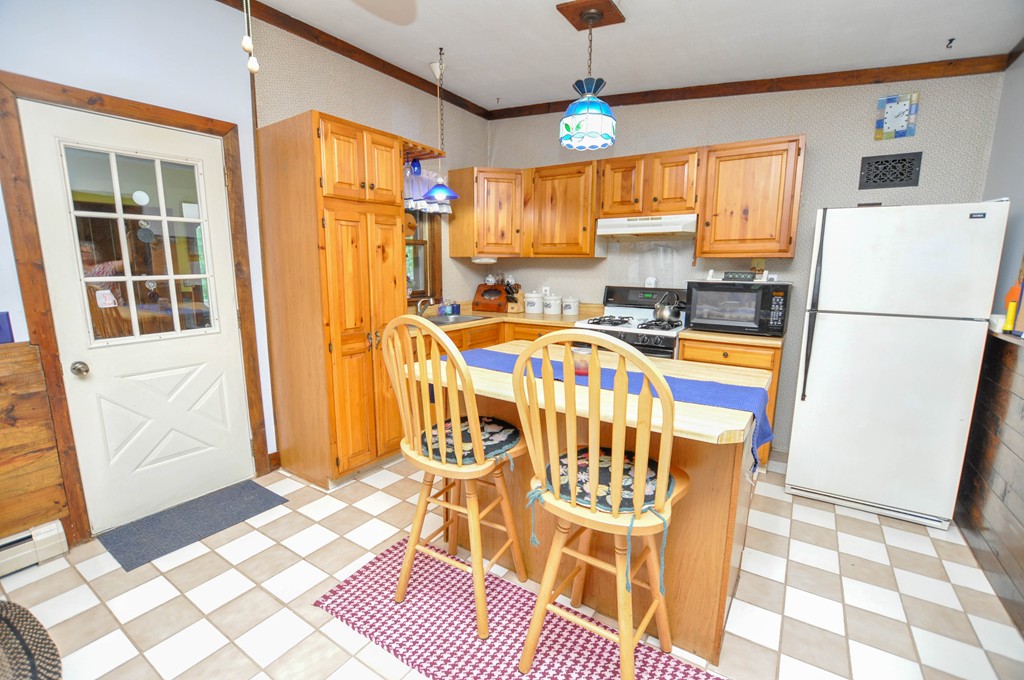3 South Row Road Lunenburg, MA 01462 - Photo 3 of 29 a view of a kitchen with furniture and a window