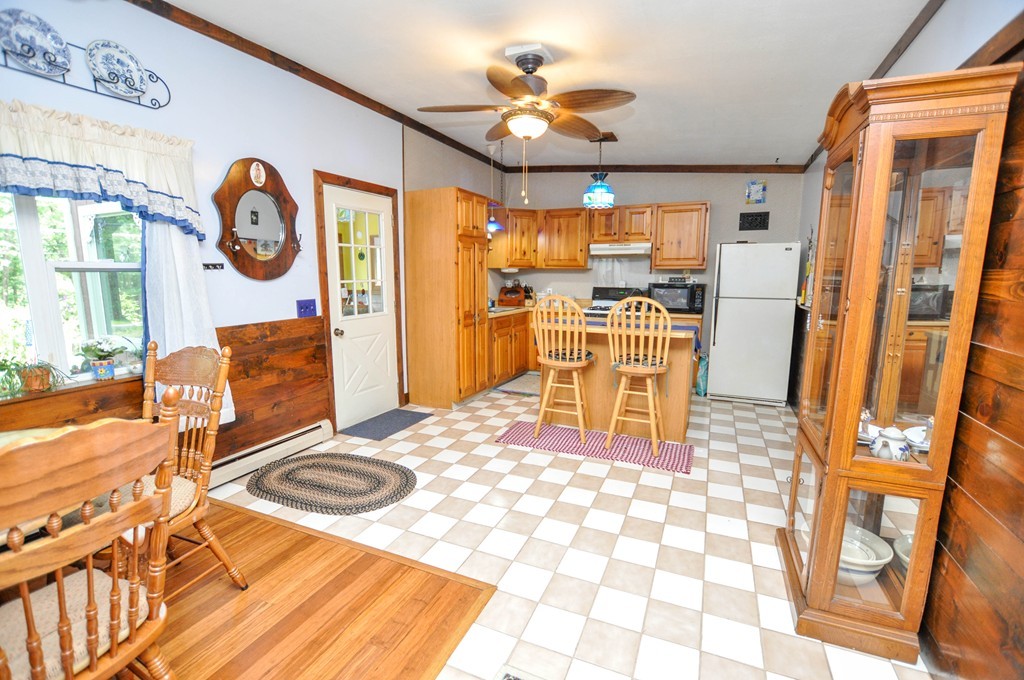3 South Row Road Lunenburg, MA 01462 - Photo 4 of 29 a living room with stainless steel appliances furniture a rug and a view of kitchen