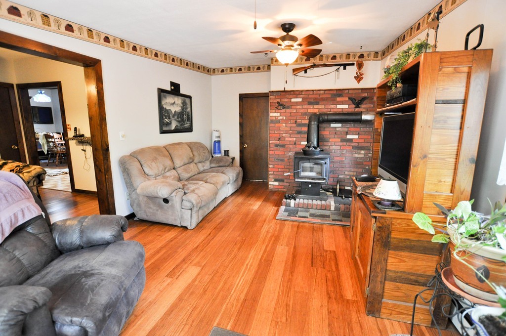 3 South Row Road Lunenburg, MA 01462 - Photo 7 of 29 a living room with furniture and a chandelier