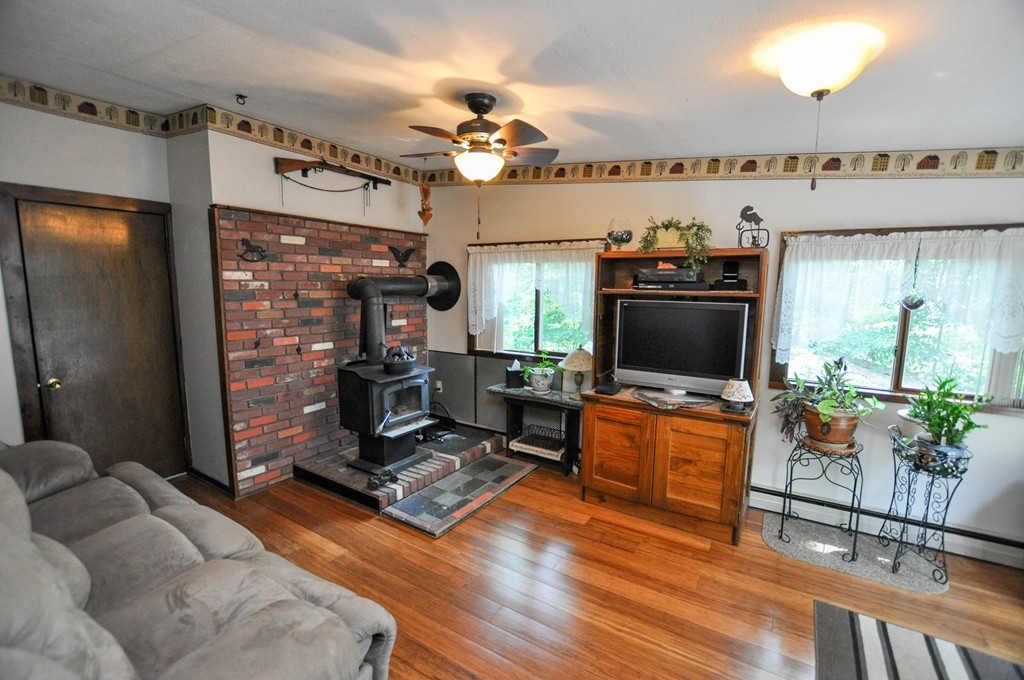 3 South Row Road Lunenburg, MA 01462 - Photo 8 of 29 a living room with furniture and a flat screen tv