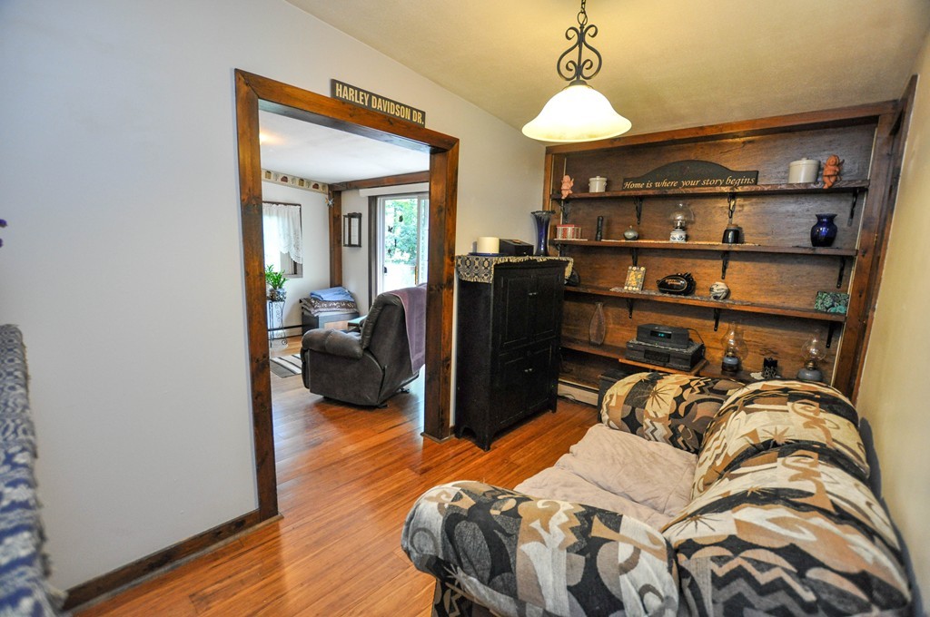 3 South Row Road Lunenburg, MA 01462 - Photo 9 of 29 a bedroom with a bed and wooden floor