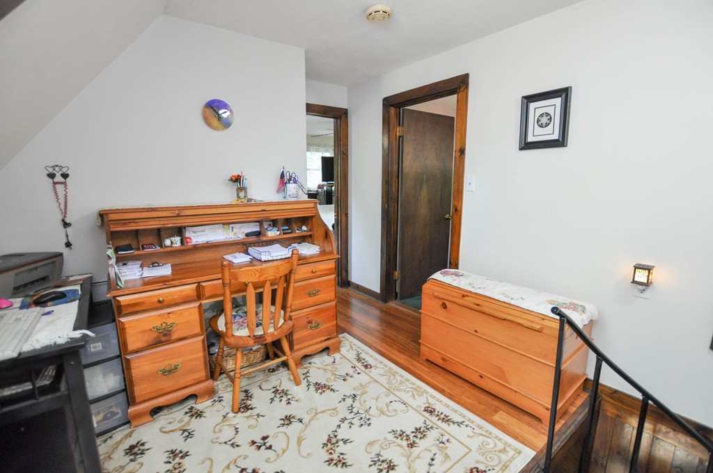3 South Row Road Lunenburg, MA 01462 - Photo 10 of 29 a bedroom with a bed and wooden floor