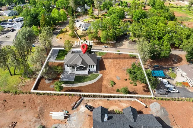an aerial view of residential building with green space