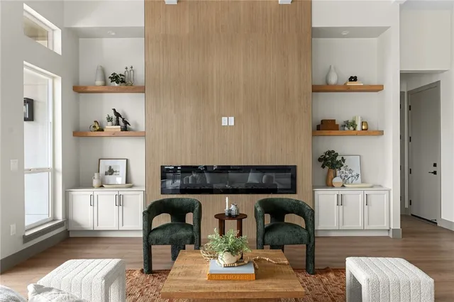a kitchen with kitchen island a stove a table and chairs in it