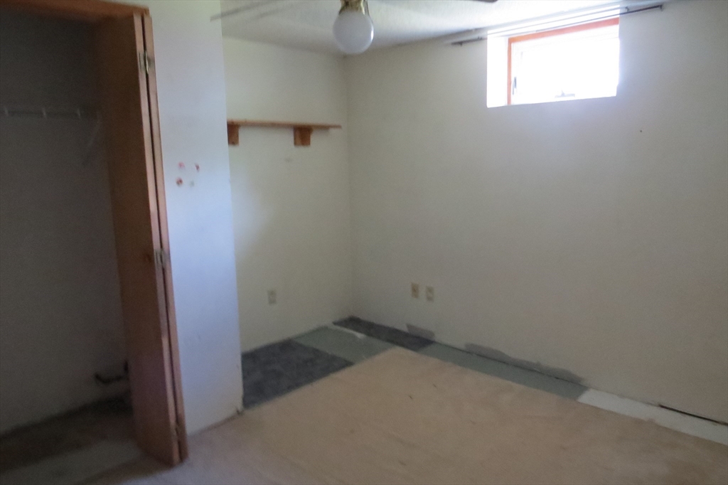 33 Coughlin Road Easton, MA 02356 - Photo 14 of 15 an empty room with a mirror
